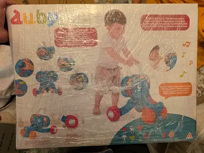 Baby 2-in-1 Push Walker and Ride-On (new, boxed)
