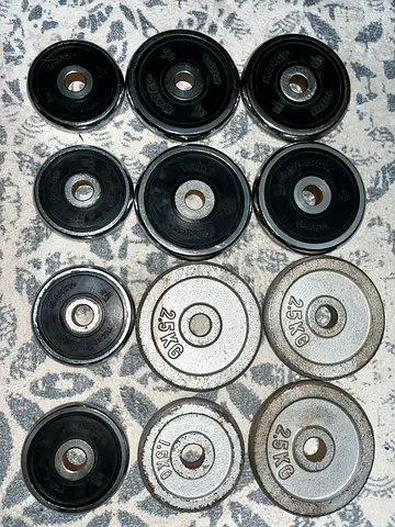 Assorted weight plates set — various 1.5kg & 2.5kg plates (good used condition)