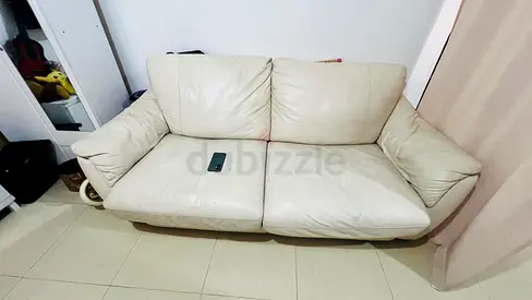 Cream leather 2-seater sofa Bed in good condition