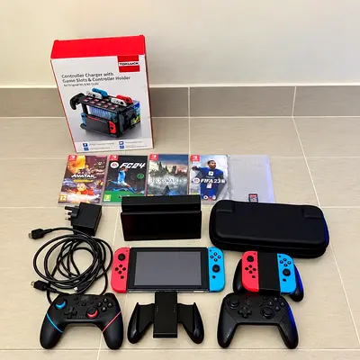 Nintendo Switch console 1st Generation Version 2 (2020) + controllers, games, case, charging station