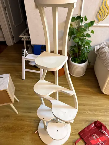 White wooden bar table with three matching bar stools