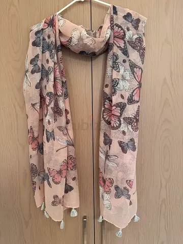 Next Lightweight pink butterfly scarf with tassels