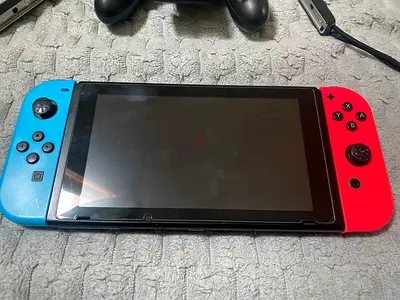 Nintendo Switch V1 USED with Joy-Con (red & blue) - good working condition No Dock, No Charger.