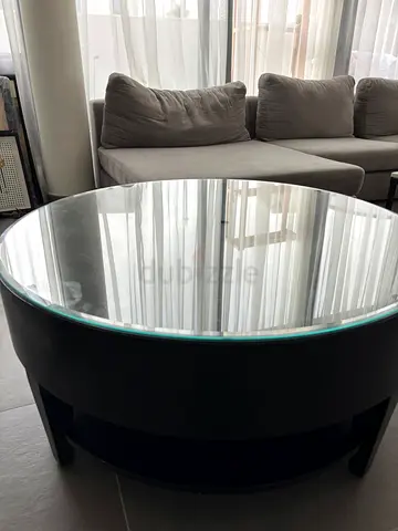 Round black coffee table with glass top - sturdy, good condition