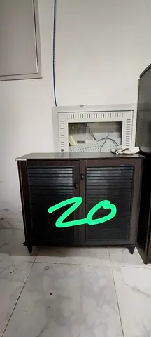 Compact dark wood storage cabinet with louvered doors - good condition