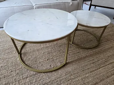 Pair of round white marble side tables with brass legs. Excellent condition. Excellent quality