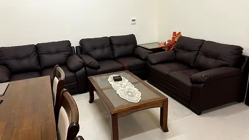 Brown leather 3-piece living room sofa set with center table and two side tables