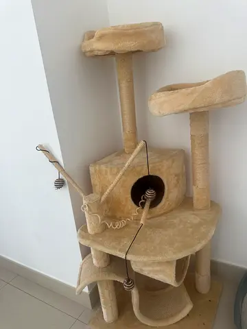 Beige multi-level cat tree with scratching posts and condo - my cat not scrach this
