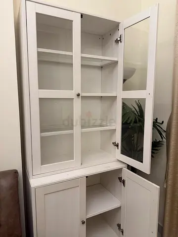 White wooden display cabinet with glass doors - good condition