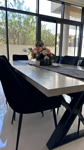 Modern Dining Table with Cross-Leg Base and 6 Velvet Chairs
