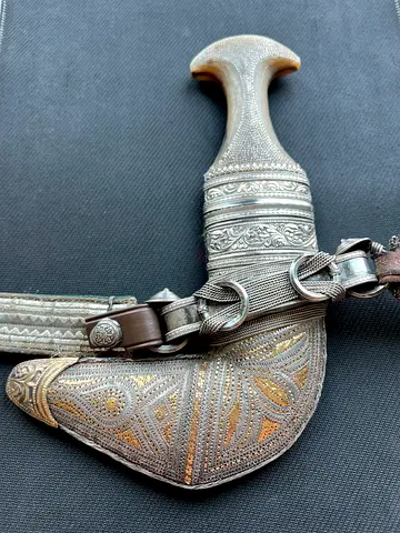 Antique Omani Khanjar dagger with ornate silver hilt and sheath