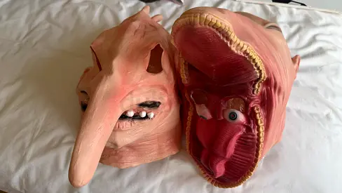 Pair of full-head Halloween latex masks from Beetlejuice