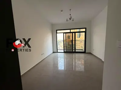 New one-bedroom apartment with a living room for annual rent in Al Bustan – includes a balcony and free parking.