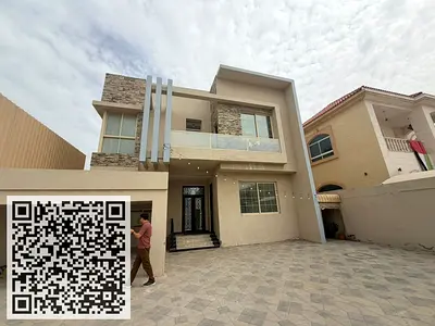 Villa for sale in Al Rawda, Ajman; includes water, electricity, and air conditioning.