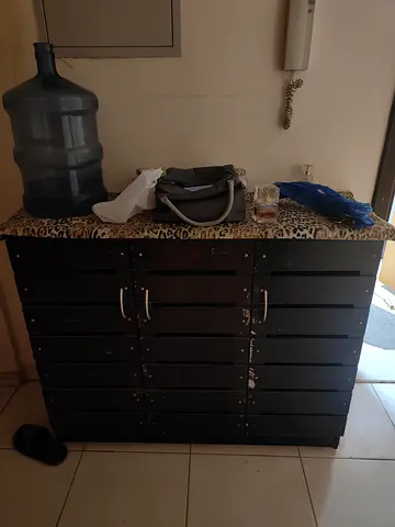 Wooden shoe cabinet with leopard-print top — used