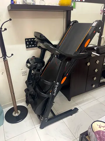 Foldable treadmill with built-in exercise bike and weight plate - used