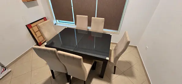 6-seater glass top dining table with upholstered chairs - good condition video available on request