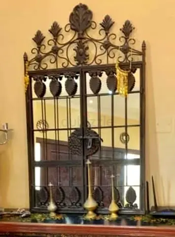 Ornate Metal Framed Wall Mirror with Decorative Crest