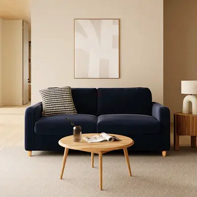 Navy blue velvet upholstered loveseat
