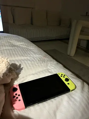 Nintendo Switch with Pink and Yellow Joy-Cons