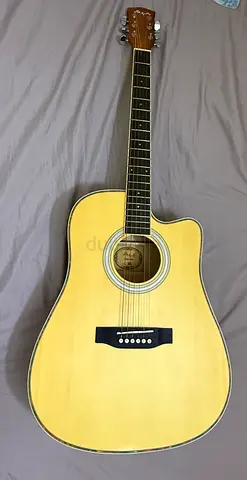Used full-size acoustic guitar with cutaway - playable condition