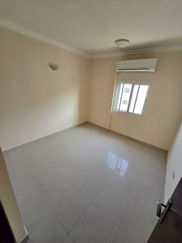 1BR for annual rent in Sharjah. Spacious, free parking, balcony with open view, and flexible payment plans up to 6 installments.