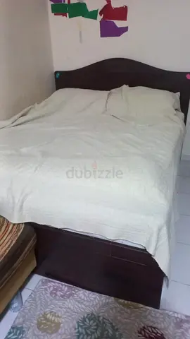 Bed frame (without mattress) with two drawers and a mirror.