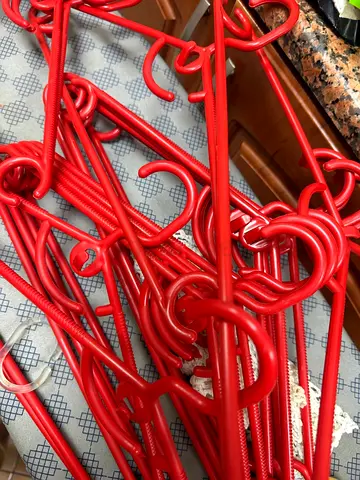 Bundle of Red Plastic Clothes Hangers - 16+ pieces