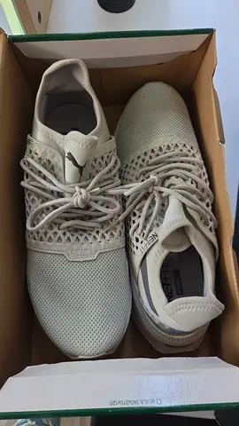 Light grey Puma running shoes - size not marked (used)