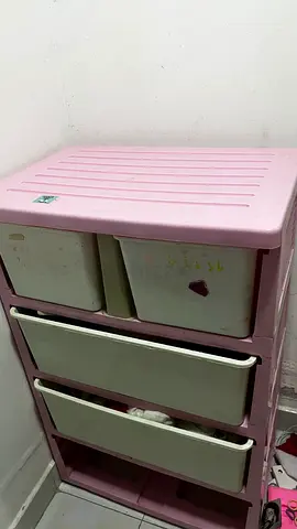 Pink plastic baby nursery storage drawer unit with removable bins