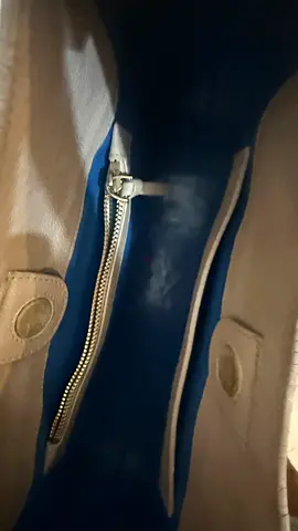 Beige leather tote bag with blue interior, zip pocket