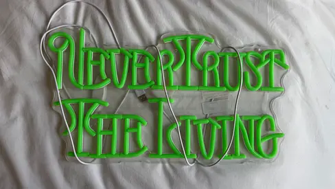 Green 'Never Trust The Living' neon wall sign - used decorative halloween light