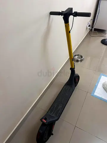 Lightly used yellow electric scooter – good condition