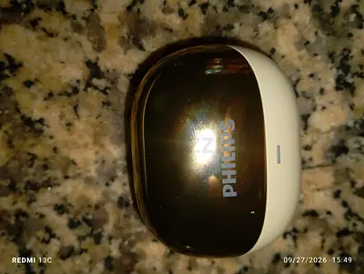 selling Phillips earbuds gold color
