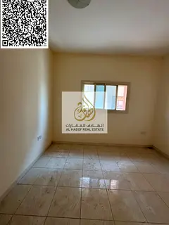 For rent in Ajman: A spacious two-bedroom apartment with a living room in Al Rawda. Payment faciliti
