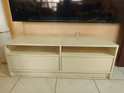 Simple white TV cabinet / entertainment unit with drawers