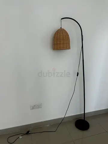 Black arc floor lamp with woven rattan shade - good condition