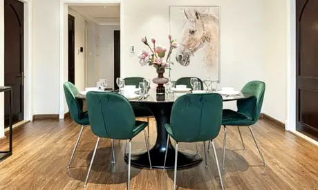 Modern round dining table with 6 green velvet chairs - set