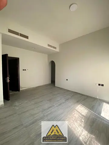 A two-bedroom apartment with a living room is available for annual rent in Al Jurf 3, Ajman. This is a great opportunity to live in a new building in