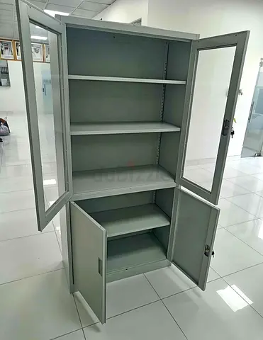 Tall metal storage cabinet with glass doors and lower locked compartment