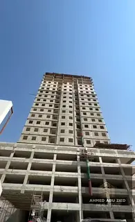 Reselling a one-bedroom apartment with a living room in Al Amirah Tower, with a down payment of 52,8