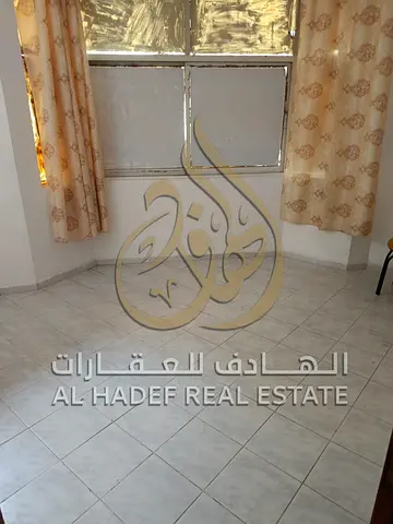 One-bedroom apartment with a living room in Al Nab'ah; features a balcony and an open view, with na