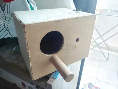 Wooden bird nesting box / birdhouse with perch - good condition