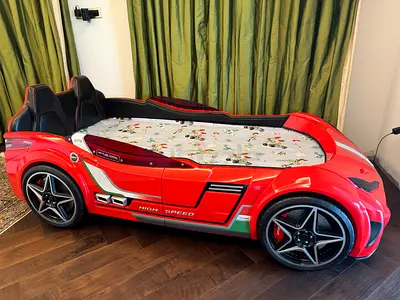 CILEK GTS EV Red Twin-Size Race Car Bed
with Remote, Underbody Lights and Leatherette Interior