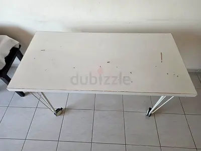 White folding table on wheels — used, sturdy surface
