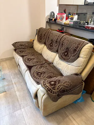 3-seater cream leather recliner sofa with patterned covers - good condition