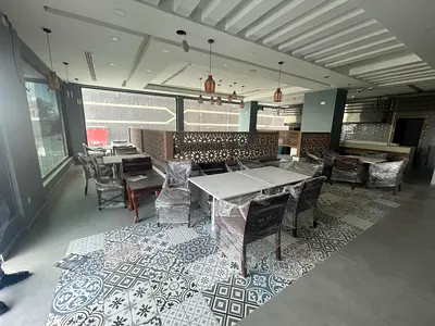 A fully furnished restaurant with central air conditioning, ready for immediate operation, complete with all equipment and brand new furnishings. The