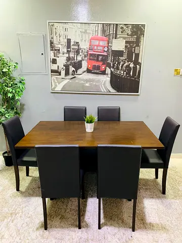 Solid Wood Dining Table with 6 Black Leather Chairs - Good Condition
