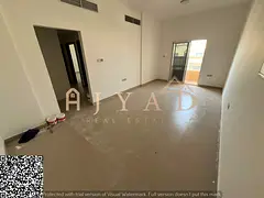For annual rent in Ajman, Al Mowaihat 3, 2BR apartment with open-view balcony and central AC, near t