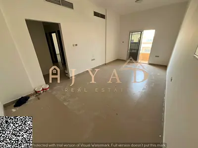 For annual rent in Ajman, Al Mowaihat 3, 2BR apartment with open-view balcony and central AC, near